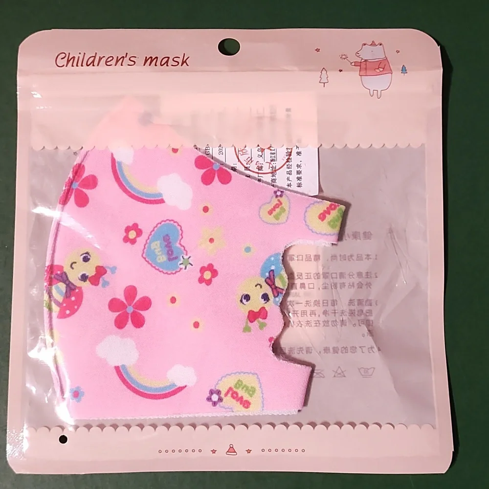 Children's re Usable face mask new in package never opened